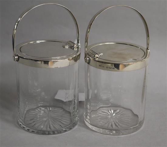 A pair of Edwardian silver mounted glass preserve jars by Asprey & Co Ltd, Birmingham, 1909, 15cm over handles.